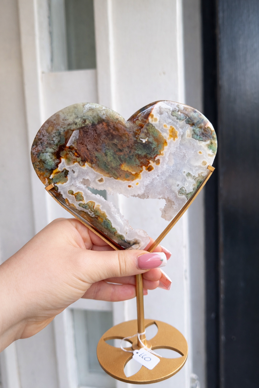 Moss agate heart on a stand