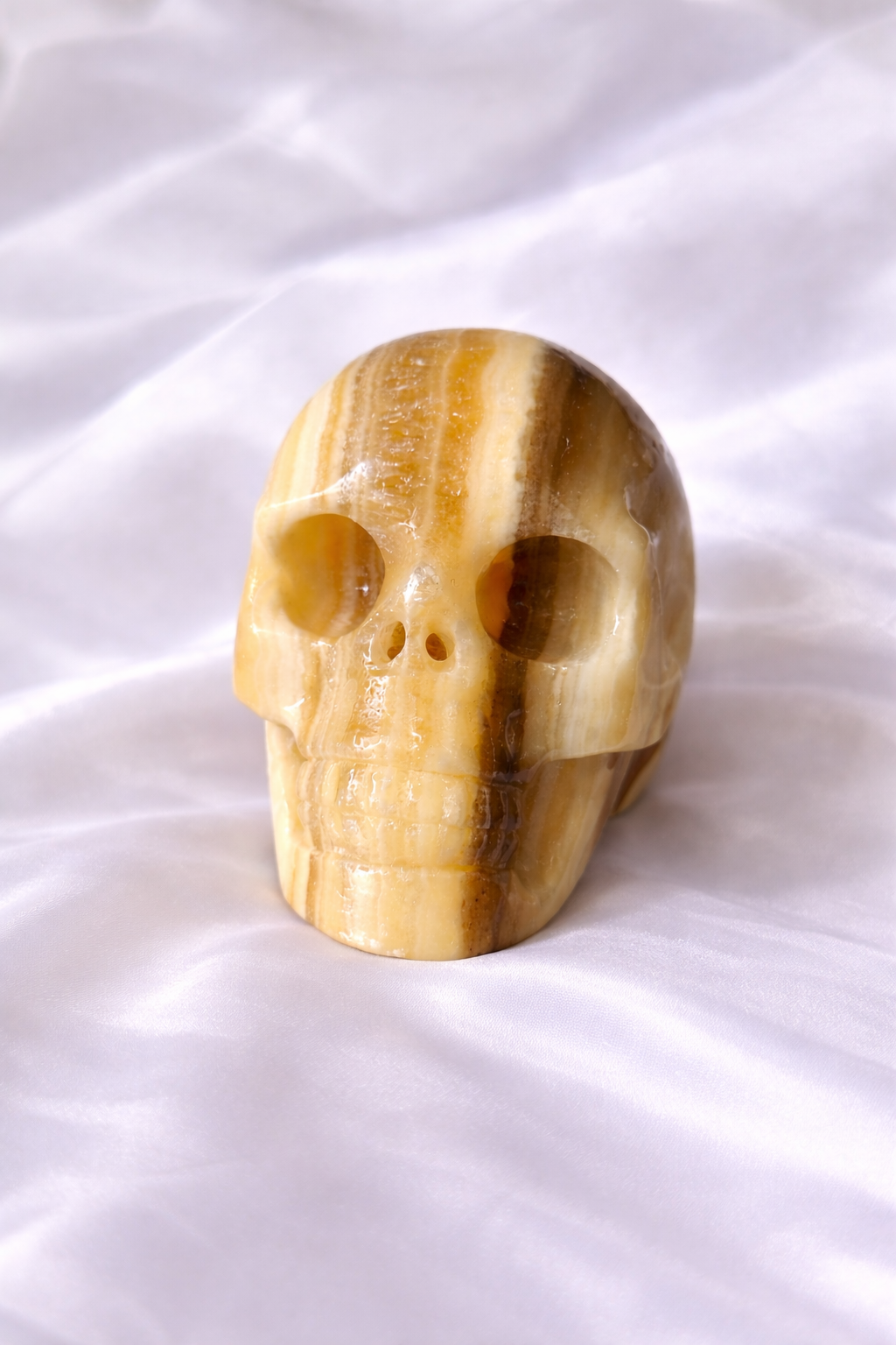 Zebra x orange calcite skull